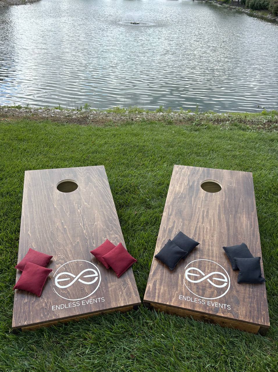 Large outdoor party setup with cornhole