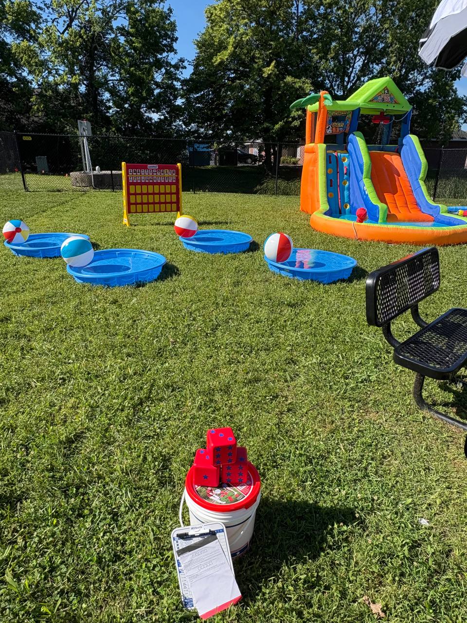Inflatable slide and water game party rentals in use